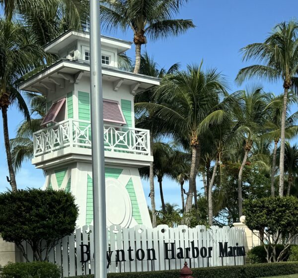 Entrance tower and palm trees at Boynton Harbor Marina in Boynton Beach Florida